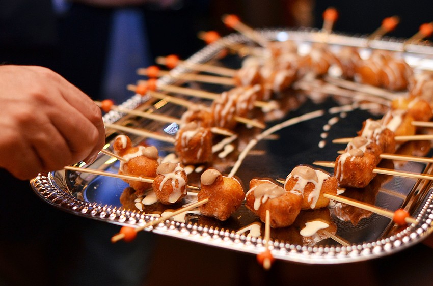 Guests enjoyed hors dâ€™oeuvres before sitting down for a 4-course dinner prepared by the celebrity chefs.