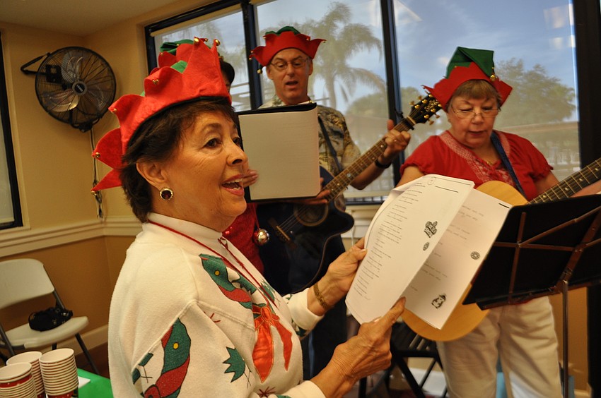 Pamela Hazell and friend sing Christmas carols.
