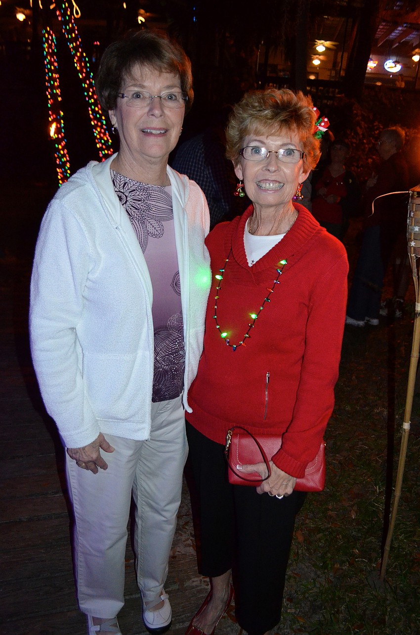 Sue Peterson and Jackie Burke watch the parade from the sidelines.