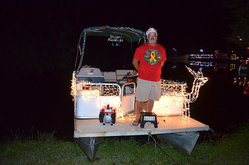 Tom Keister gets in touch with his inner Santa Claus on his boat.