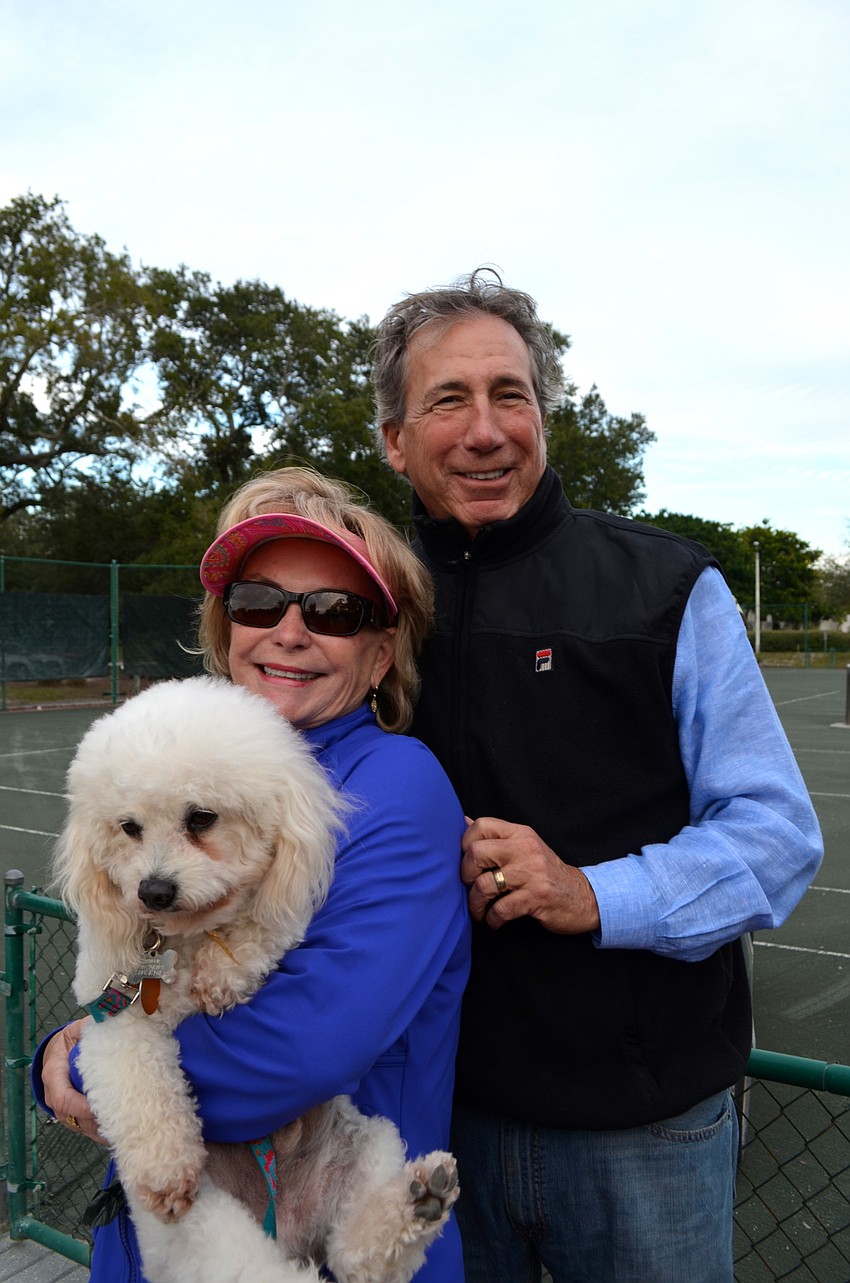 The Deane family â€” Phillip, Laurie and Jeff â€” cuddle up on a cool evening.