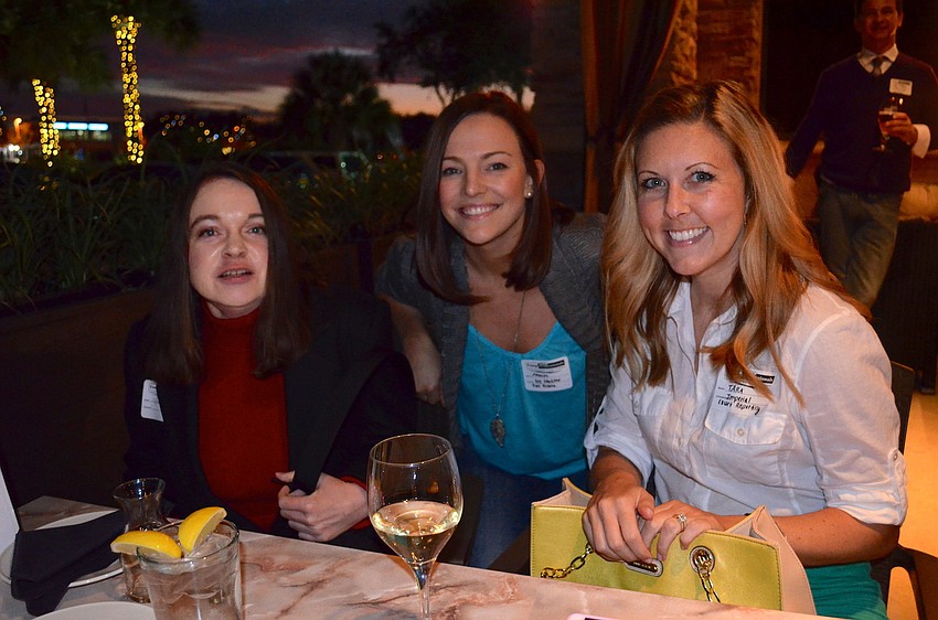 Louise Newman, Tara Shuck and Amanda Durbin wait for their dinner to arrive.