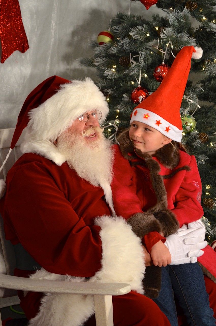 Santa chats with Eva Abraham.