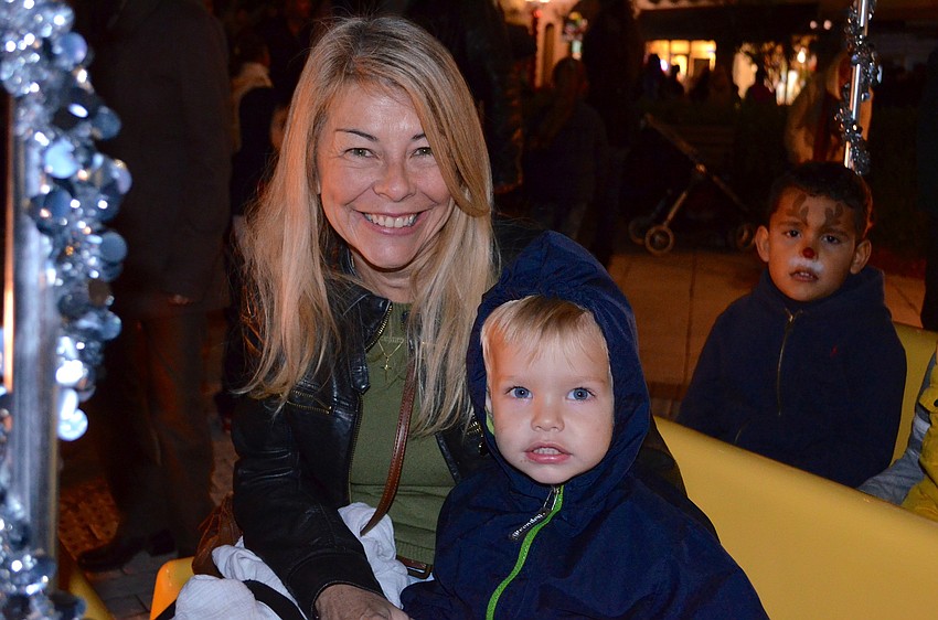 Mary Harring and Callin Westfall ride around Main Street.