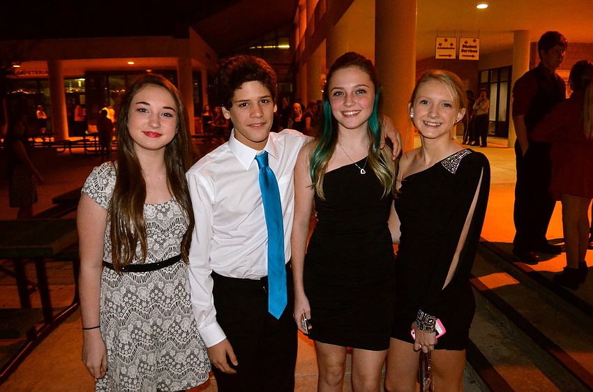 Abby Krakowski, Josh Demurias, Maddison Spencer and Meghan Corbran wait in the courtyard for the dance to start.