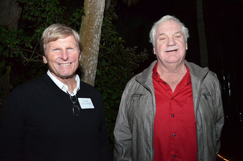 Doug Archibald and Jim Armour stroll the gardens at Marie Selby Botanical Gardens.