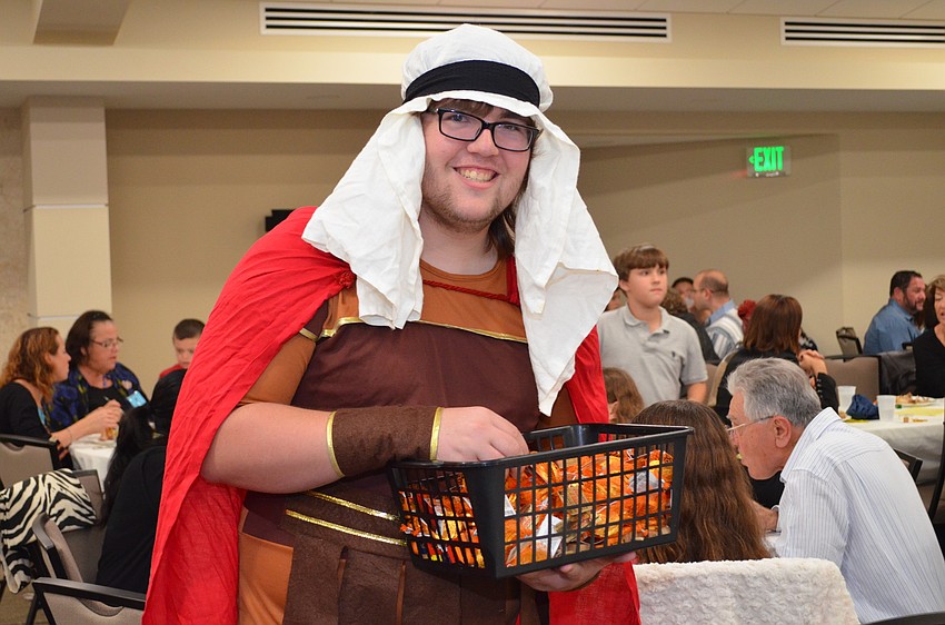 Adam Caldwell dressed as Judah Maccabee for the event and handed out dreidels to children.