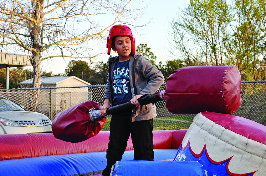 Zaid Harakat, 10, tests his battle skills at a Tara Elementary School fundraiser.