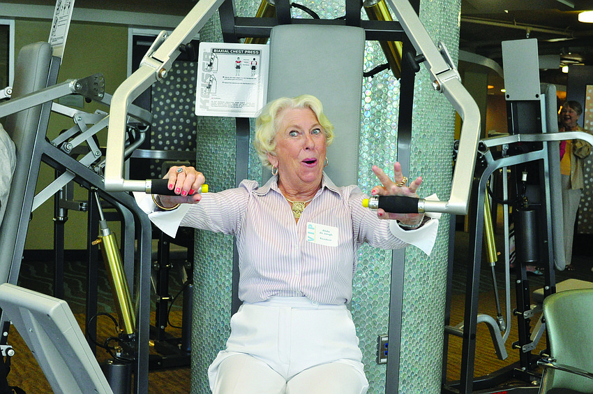 Alida de Jongh tests out new exercise equipment at a Sept. 12 ceremony that celebrated the dedication of Plymouth Harbor's Wellness Center.