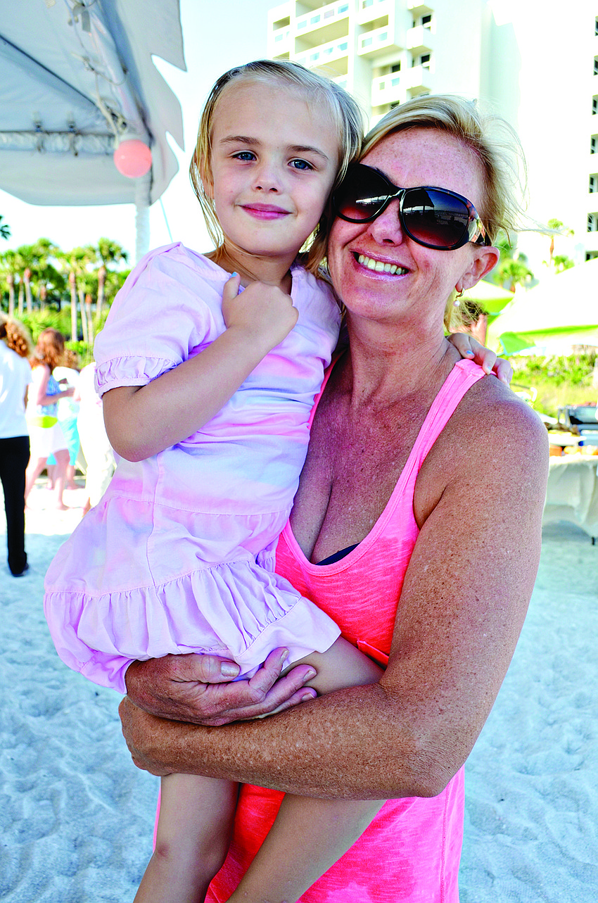Monica Shea with her daughter, Delaney, enjoy the Memorial Day barbecue held May 24 at the Longboat Key Club.