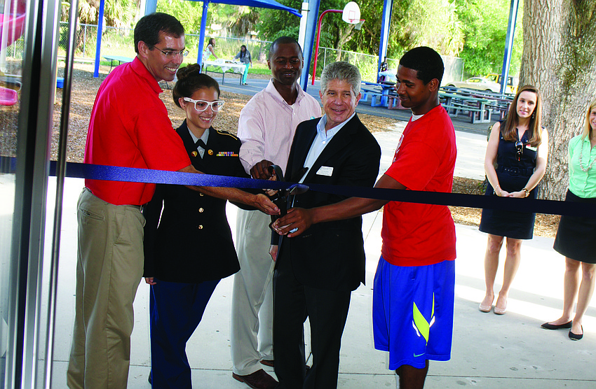 David LaCamera, Maria Monroy, Ken Waters, Tom Shapiro and Matthew Graham celebrate the completion of the 2014 Leadership Sarasota's volunteer project at the Roy McBean Boys and Girls Club.