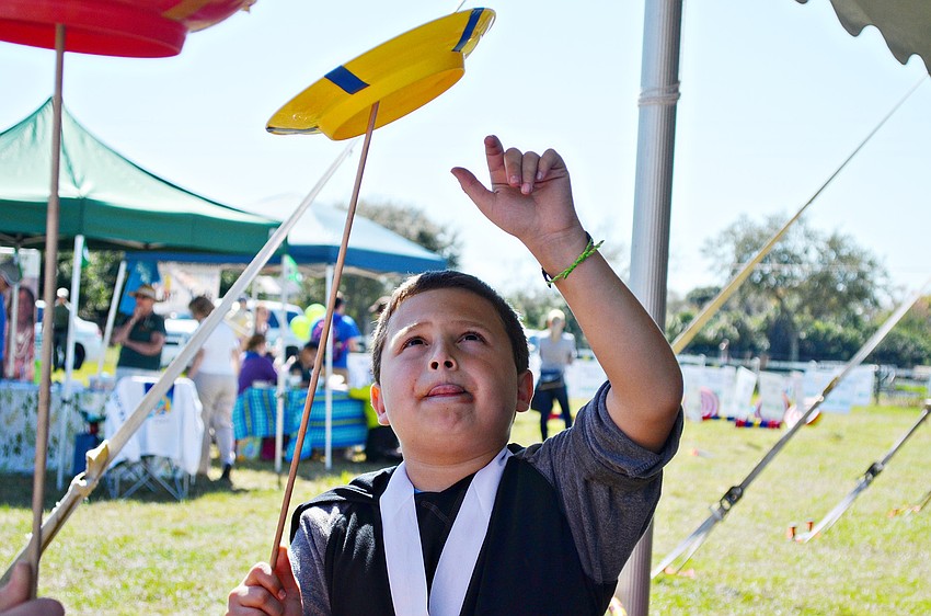 Devin Rubinstein spins a plate at the eighth annual Sarasota Springfest in Palmer Ranch.