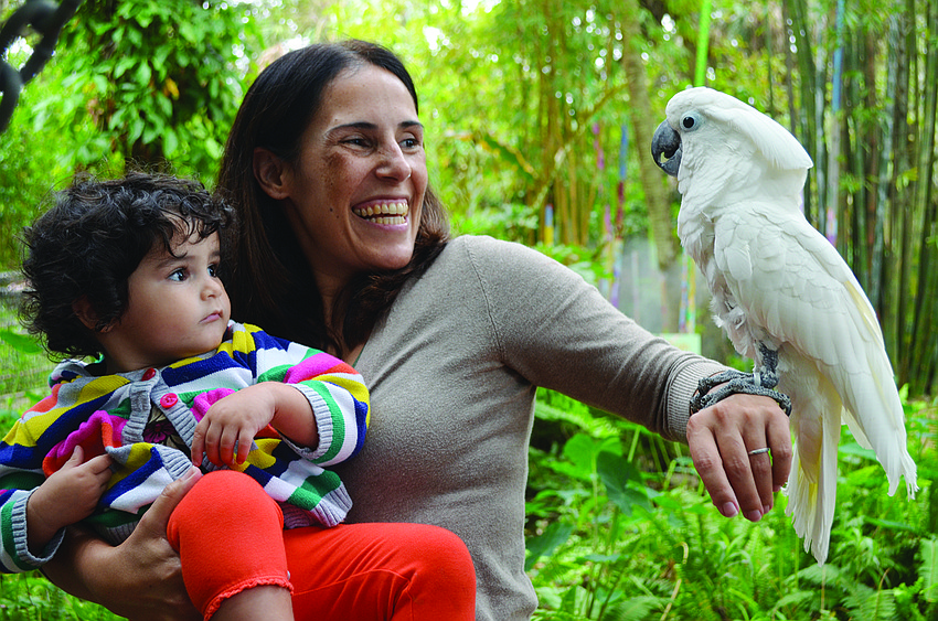Amanda Schumer and Aparecida Torres meet Wyatt at the Humane Society of Sarasota's Cause for Paws event at the Sarasota Childrenâ€™s Garden.
