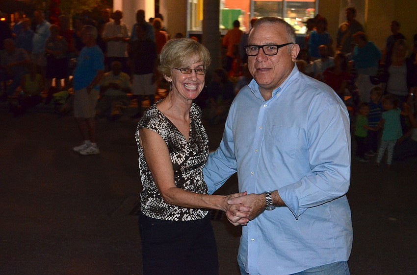 Peggy Martin and Warren Strauss dance to the music.