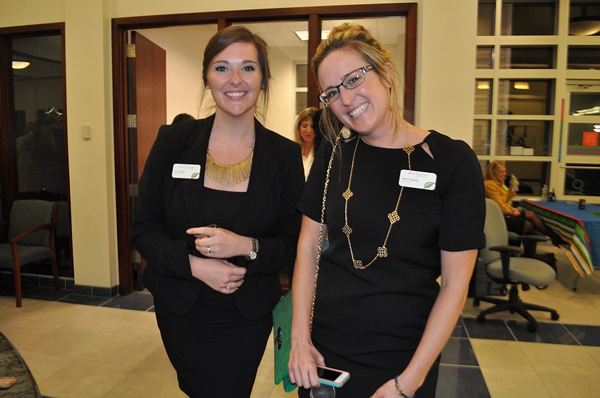 Katy Sanger and Heidi Hackney, of Grow Financialâ€™s soon-to-open Clearwater location, attend to see best practices for hosting a party.