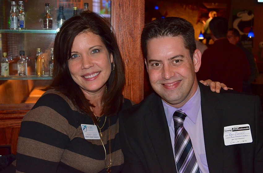 Lindsey Leech and Ben Baker welcome members to the event.