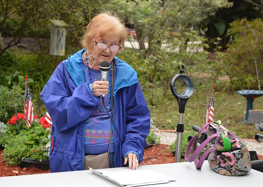 Virginia Sanders, organizer of the event, speaks to attendees.