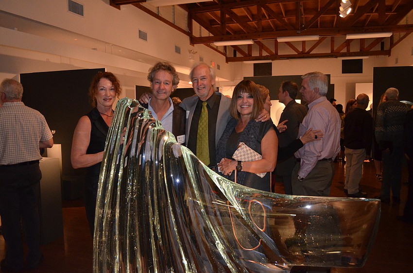 Janet Hargus, artist Peter Bremers and Kathy and Ferdinand Hampson, of Habatat Galleries pose behind â€œTransformation XIâ€ by Bremers.