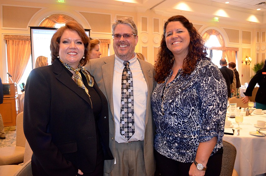 Veronica Brandon Miller, Stan Eding and Andrea Stephens enjoy time with new friends.
