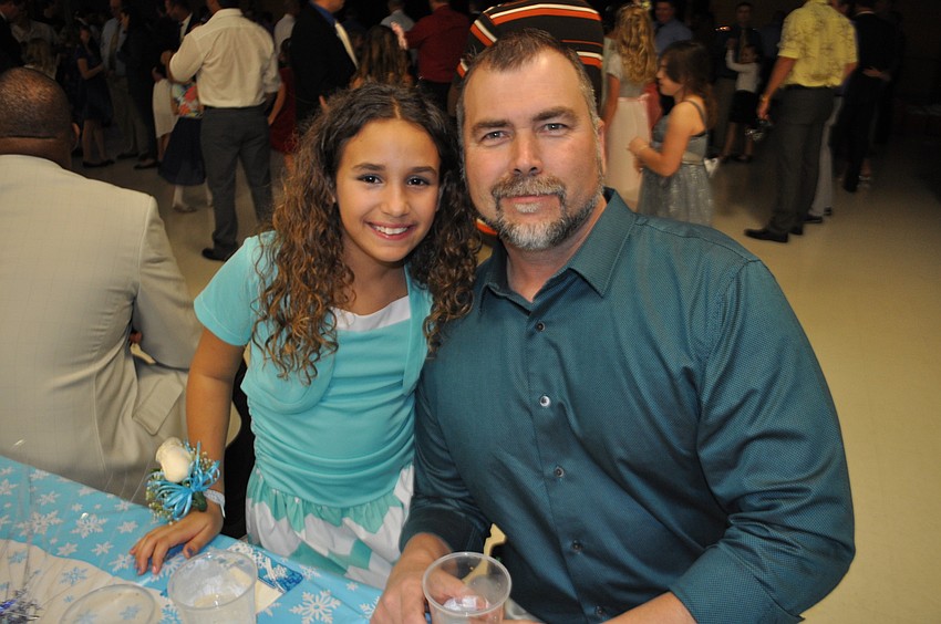 Mary-Evelyn Coutinho attends with her uncle, Tom Johnson.