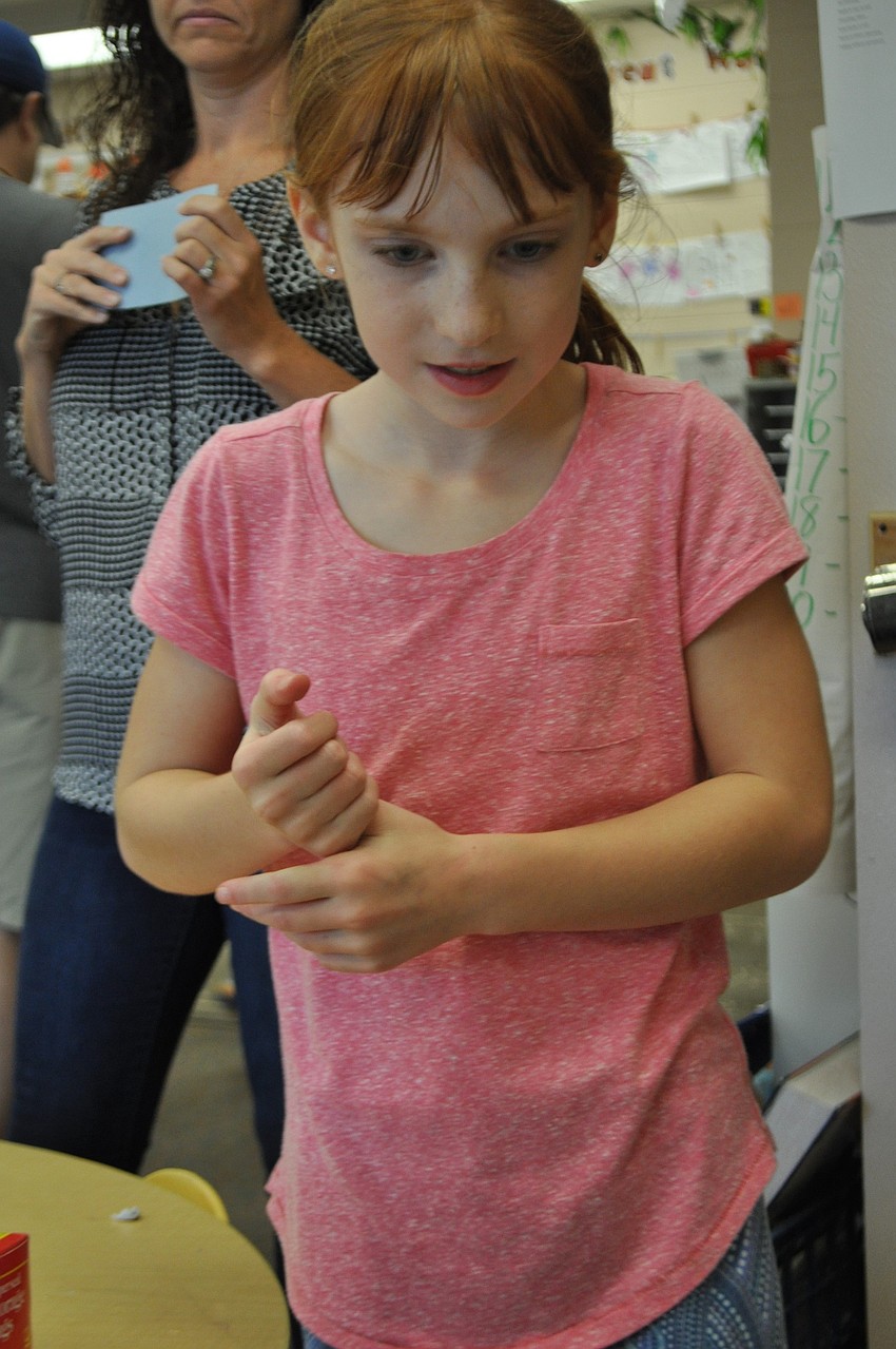 Abby Cummings, 9, is excited to win a fish.