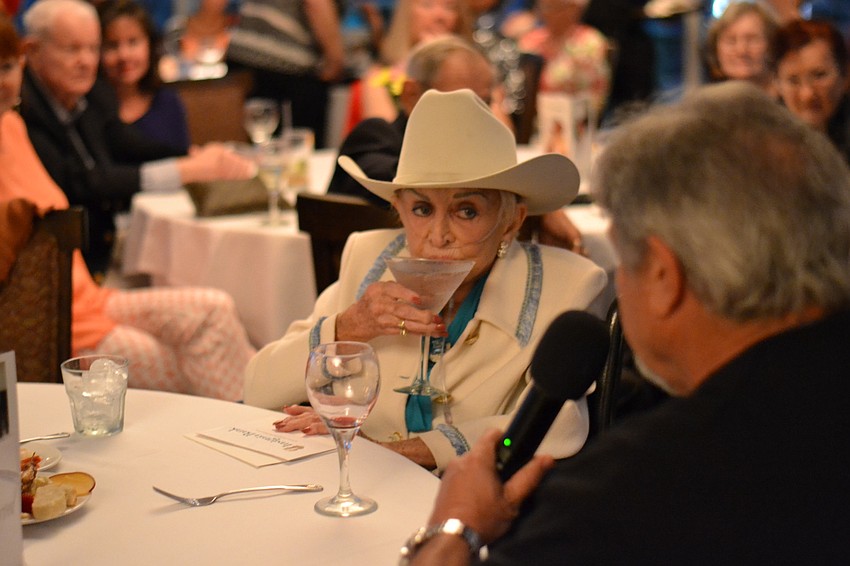 Edith Barr Dunn sips on her trademark drink, a martini.