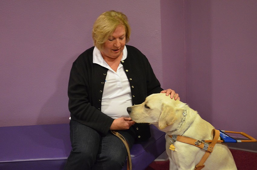 Ginny Eichholz with her guide dog, Sotheby.