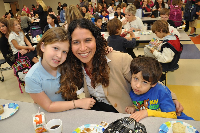Vaylin, Adria and Dylan Jensen chat as they eat.