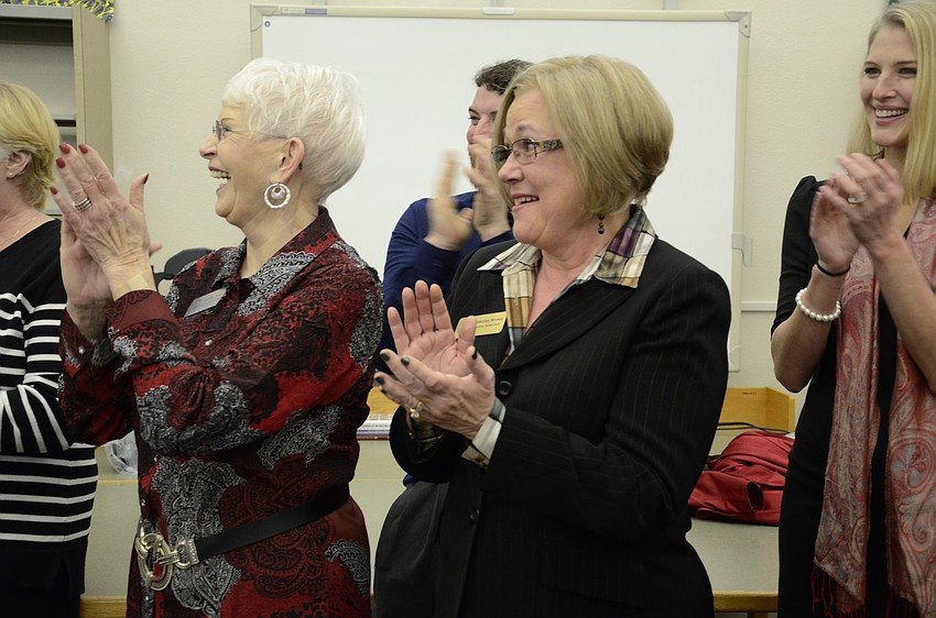 School Board members Caroline Zucker, Shirley Brown and Bridget Ziegler applaud the Middle School Teacher of the Year.
