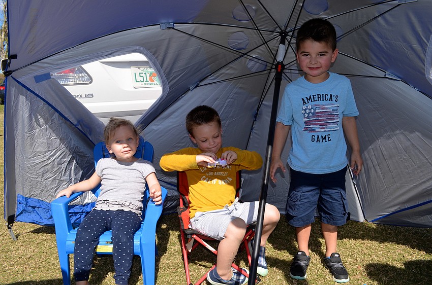 Brenlyn Madison, Brady Moore and Colton Rossi enjoy their own form of tailgating.