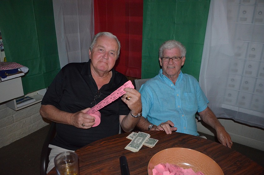Charles Craig and Don McKay sell tickets for the 50/50 raffle.