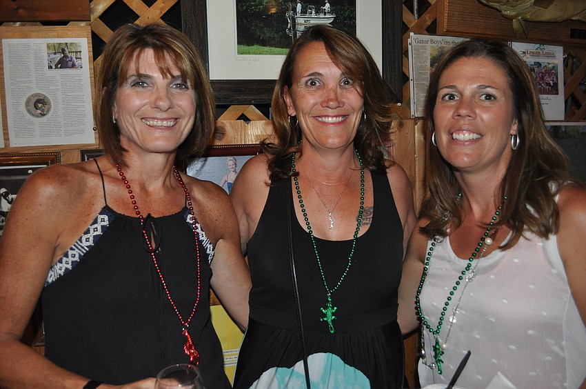 Lucy Hense, a parent of two Braden River children, with Linda Appleday, Braden River media specialist, and Amy Tribble, a parent