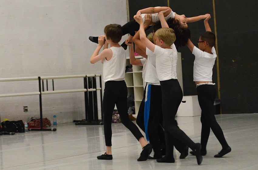 The Lost Boys carry littlest lost boy Adam Attari off stage