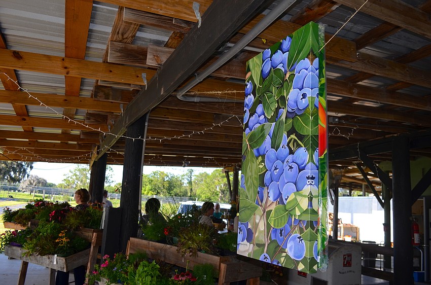 Fruit signs hang around the room.