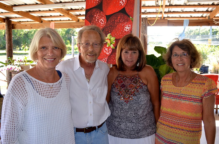 Susan Balas, Tom Rodgers, Colleen Clark and Debbie Sniadach love their fruit.