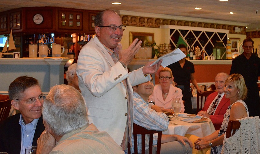 Lenobelâ€™s son, Jeffrey, speaks to guests about his fatherâ€™s life and accomplishments.