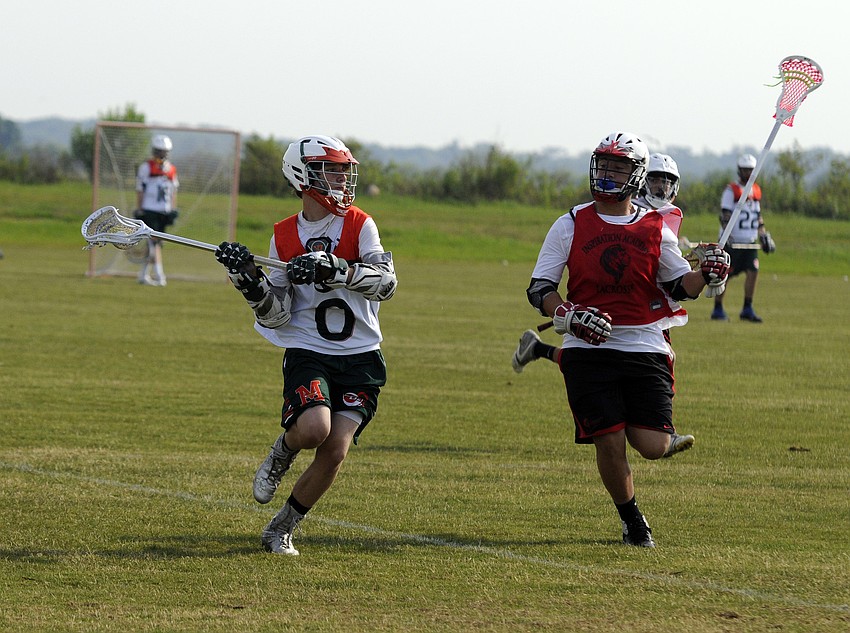 Fourteen-year-old Chris Pennewill prepares to pass the ball across the field to one of his Monsters U15 teammates.