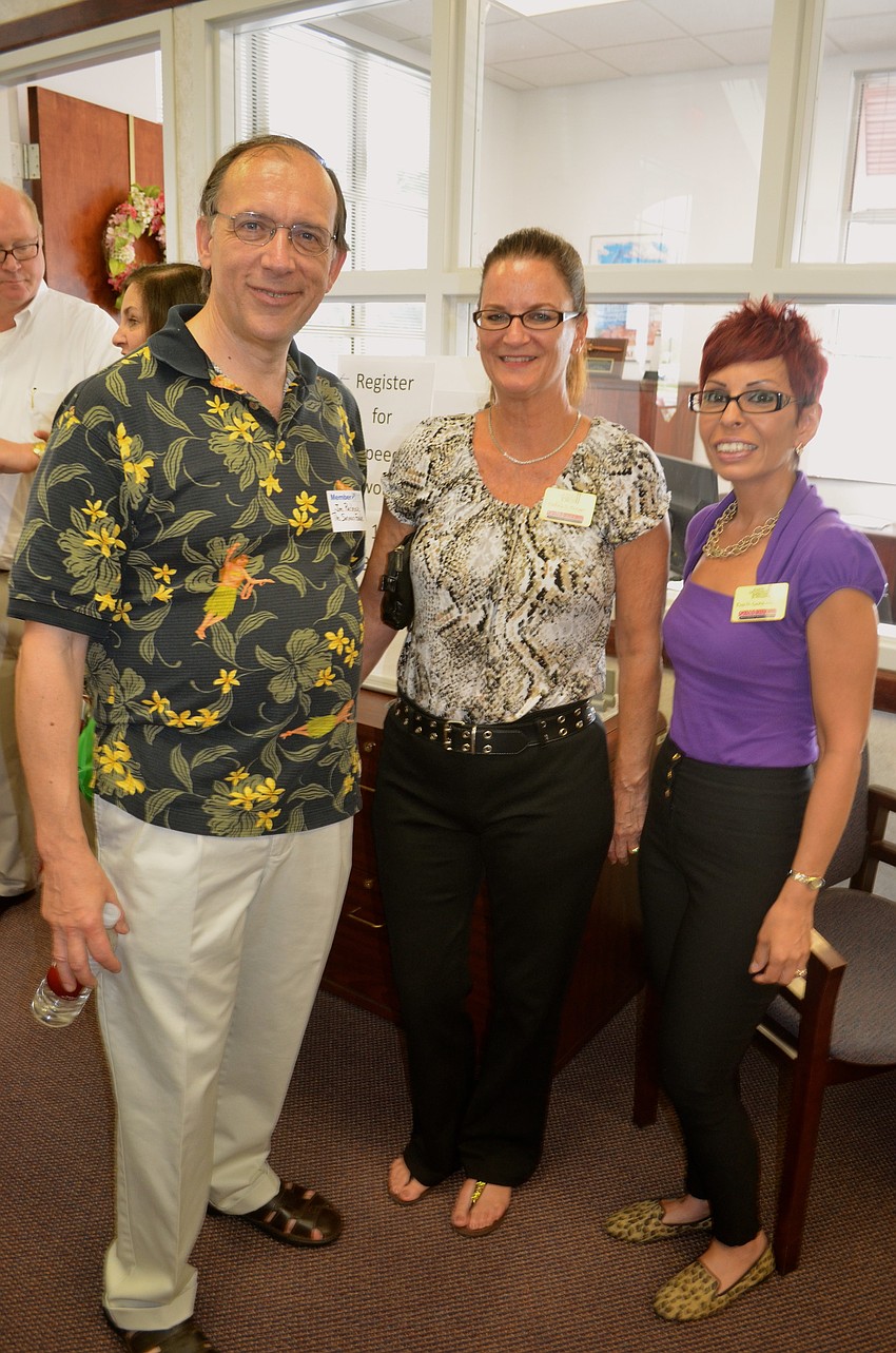 Jim Pachence, Debra Burger and Eva Gonzalez wear matching smiles.