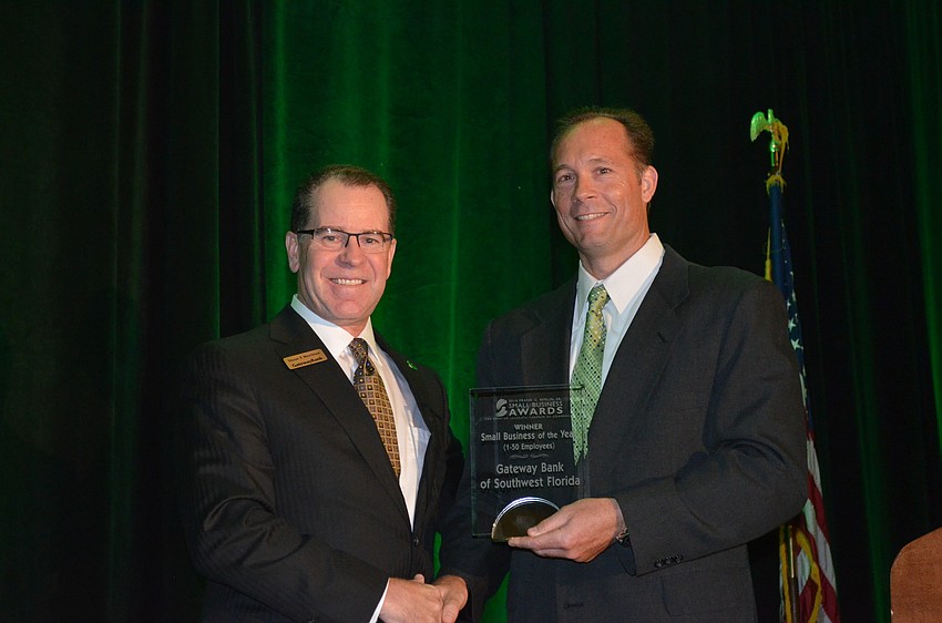 Shaun P. Merriman of Gateway Banks of Southwest Florida accepts the Small Business of the Year (1 to 50 Employees) Award from Pat Dorsey.