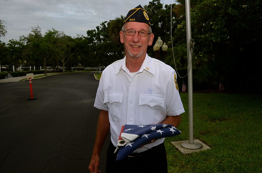 Roger DeWitt shows off the American flag.