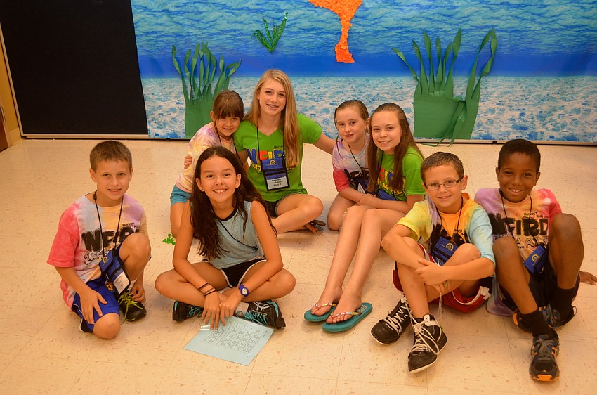 Second- through fifth-grade students watch videos.