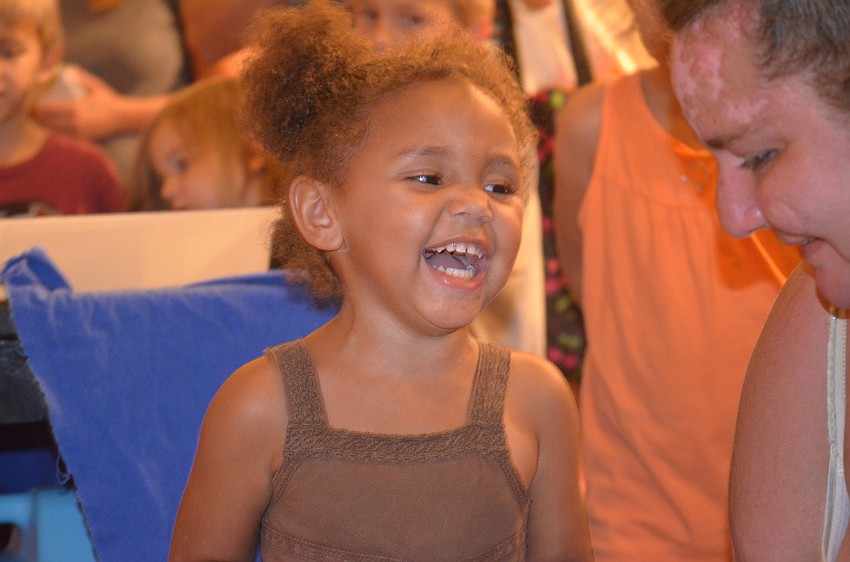 Saâ€™nora Goodwin gets splashed by the lobster with her mom, Patricia Lacy.