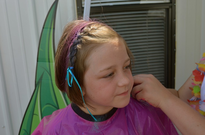 Charlie Wasson gets her hair temporarily colored purple.