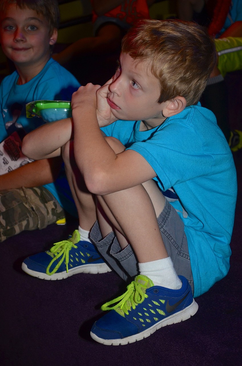 Ian Smentowski watches a movie.