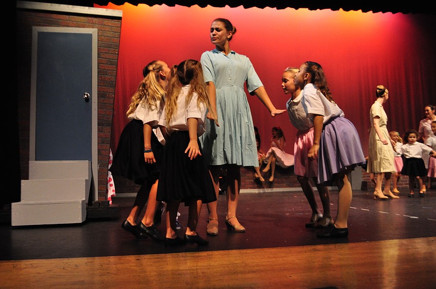 Marykate Crowley, center, acts as a mother for campers ages 5 to 7 during the performance.