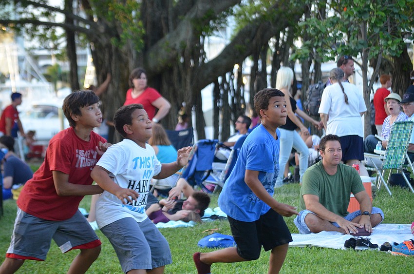Isaiah CedeÃ±o Cunningham plays football with Zion Hallett and Lewis Fernendez.