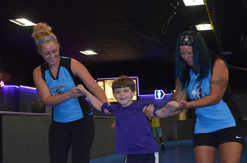 Shylynn â€œTess Ticklesâ€ Gamble and Connie â€œK-Ossâ€ Iachetta skate with Vincent Gargiulo.