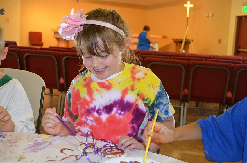 Alice Barr is all smiles as she makes a gift for her parents.