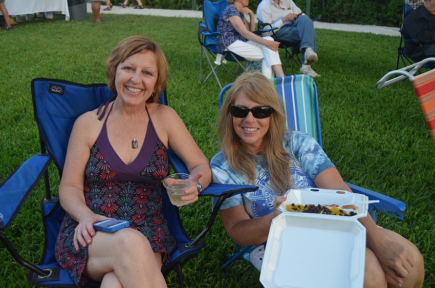 Peggy Connolly and Crystal Howard enjoy the music with dinner and drinks.