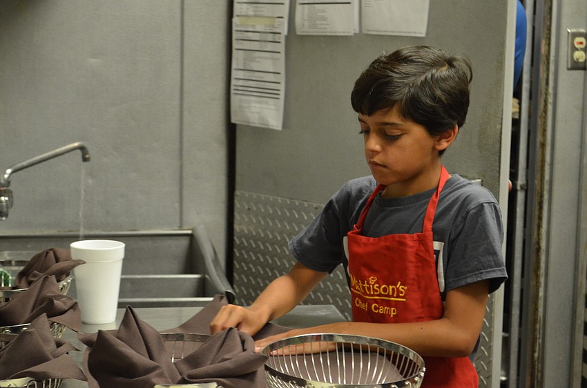 Ezra Piare prepares bread baskets